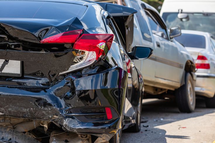 A picture of a car that has collided with the back of another